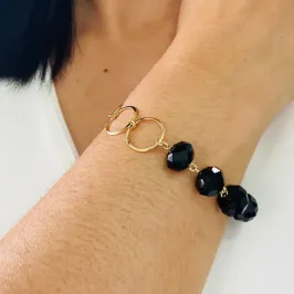 PULSEIRA DOURADA PEDRAS PRETA E CIRCULO